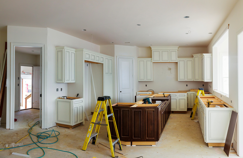 Picture of kitchen cabinets being remodeled